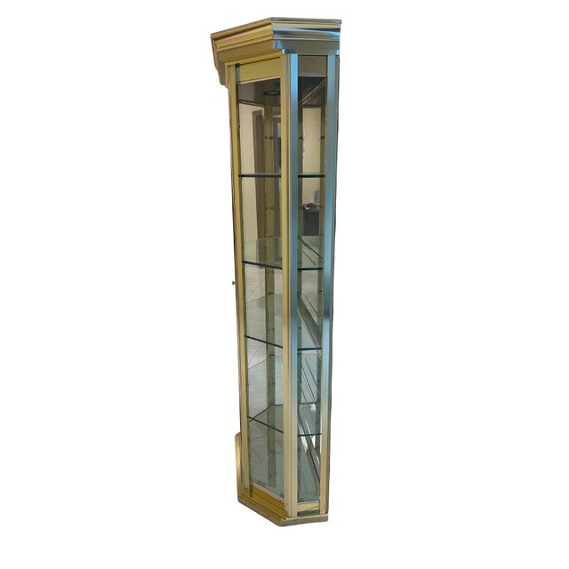 This elegant Hollywood Regency display cabinet captures the glamour and sophistication of mid-century design. Crafted with...
