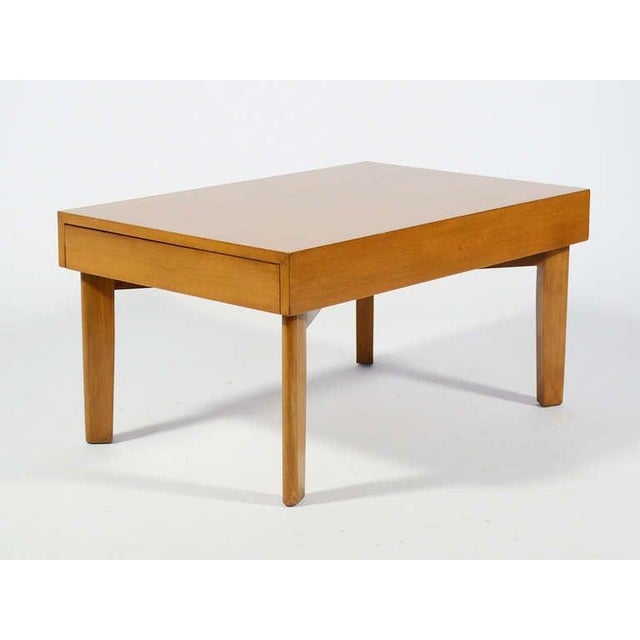This early George Nelson design features two extensions with reversible and removable tray tables. Closed, it is a...