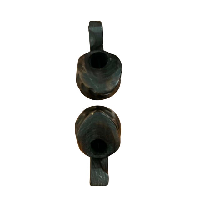 A sculptural pair of vintage hand-carved wooden pitchers crafted in Spain, showcasing an expressive organic form and...