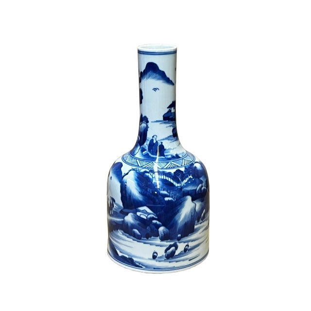 This is a Chinese decorative porcelain vase in a Blue and White color finish. The theme is an oriental scenery graphic....