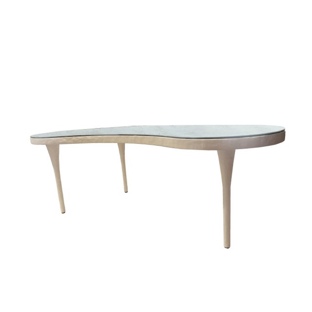 The White Remy Coffee Table by Mr. Brown Home is a striking statement piece that blends modern sophistication with subtle...