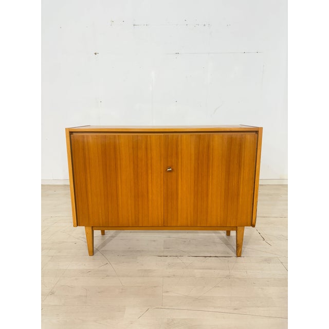 Elegant chest of drawers, which, as you can see, perfectly embodies the popular Mid-Century Modern style. It is...