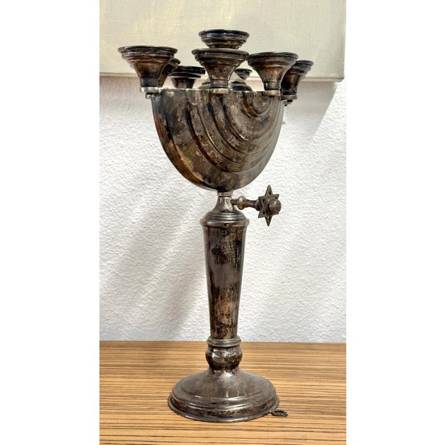 A nice early 20th century silver plated Menorah. In estate found condition, we have not tried to polish it. Nice patina....