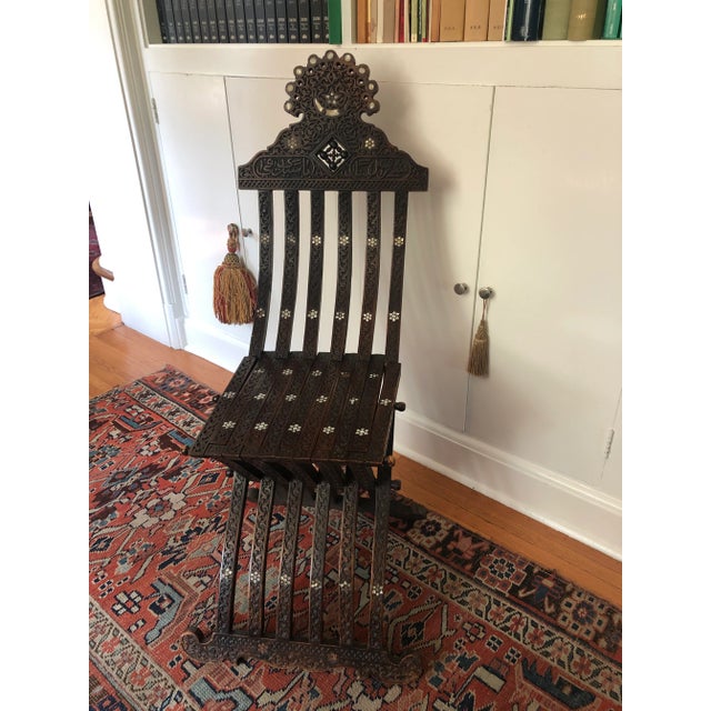 Antique Moorish Syrian Folding Chair with Mother of Pearl Inlay. Beautiful elements throughout with intricate stars and...