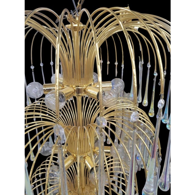A monumental sized grand vintage 25 light 6 tiered waterfall crystal chandelier light fixture. This fixture is grand in...