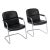 Pair of armchairs from Germany made with a tubular chrome cantilever frame and black leather upholstery. The armrests are...