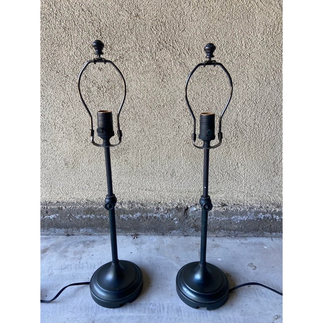 Traditionally styled table lamps by Pottery Barn featuring a weighted foundation and telescoping design. Antique bronze...