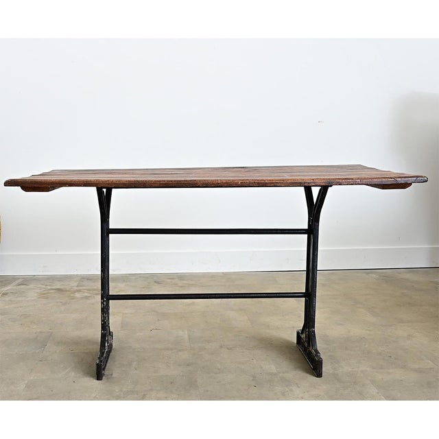 The surface of this French 19th-century bistro table is a unique combination of rustic material and elegant Belle Epoch...