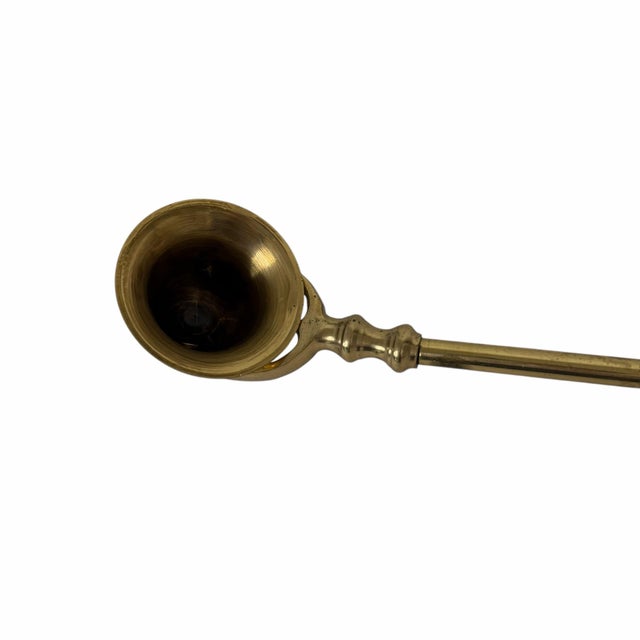 Vintage brass candle snuffer. Solid brass with nice weight. Some minor tarnish. Measures 14.5” long.