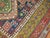 An early 20th century Shirvan rug woven in the villages of the Caucuses. 5 colorful medallions on a navy ground....