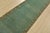 An authentic vintage traditional Tabriz runner hand-knotted with fine wool and natural dyes. This rug features a solid...