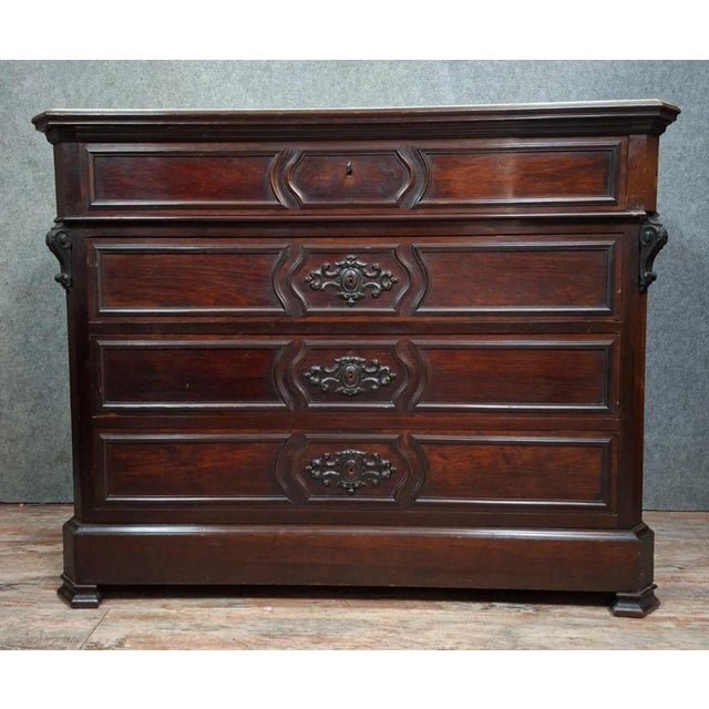 Napoleon III period mahogany and light wood secretary desk. The front opens with four drawers in the lower section and a...