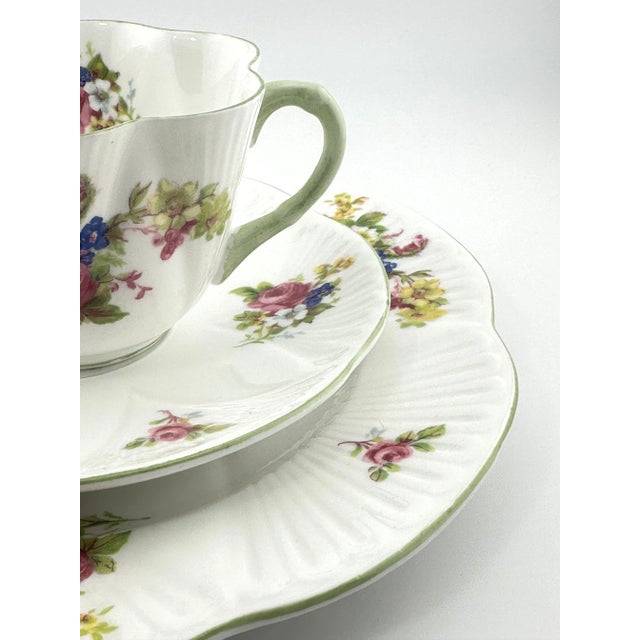 This lovely Shelley trio, Hulmes Rose Pattern, with vibrant floral sprays, includes a cup, saucer, and plate in Shelley’s...