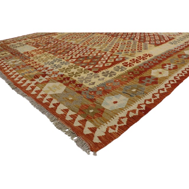 80160 Vintage Afghani Kilim Rug, 06’08 x 09’05. Full of tiny details and nomadic charm, this handwoven wool vintage Afghan...