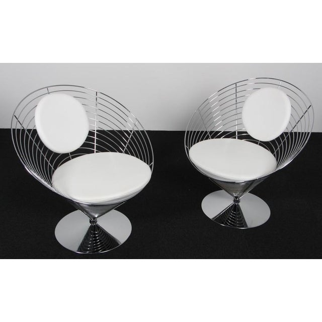 Verner Panton wire cone chair with chromed frame. Original upholstered with white leather. Model wire cone chair. This...