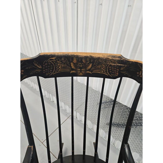 This classic Hitchcock "Connecticut" rocking chair is ebonized with a gold-stenciled harvest motif. The Hitchcock brand...
