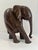 A beautifully sculptural hand-carved African elephant in richly toned kiaat hardwood, likely originating from southern...