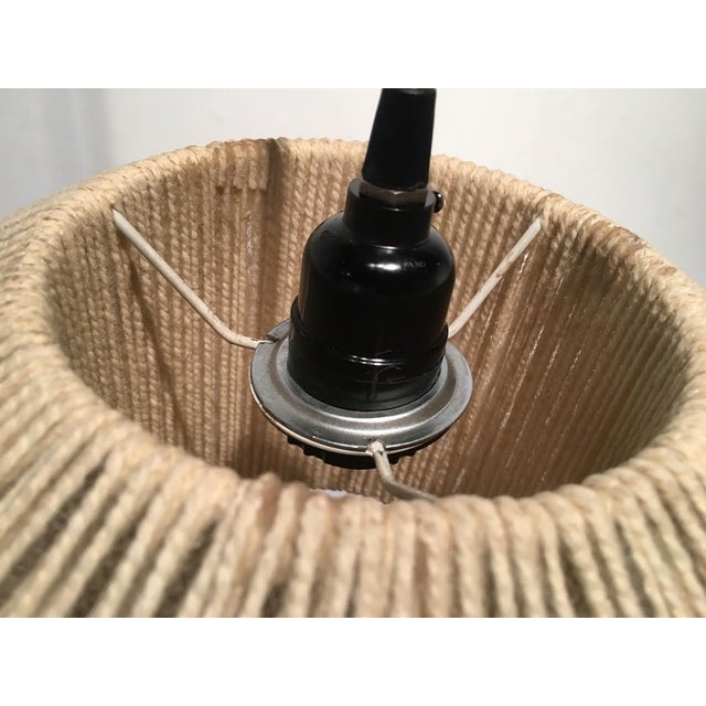 Vintage pendant light Made of a light tan twine or string Newly rewired with wooden canopy included Diameter: 13"; Width:...