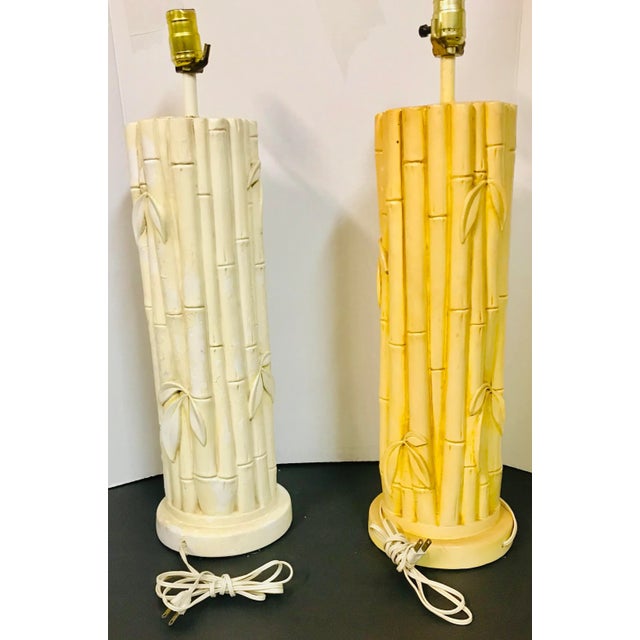 Stunning set of 2 mid-century ceramic faux bamboo lamps 1 beige 1 yellow. The beige needs a paint job. Please view...
