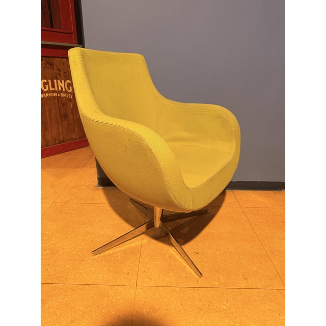 A stunning original armchair from the 1970s, featuring a soft, sinuous design reminiscent of the organic forms typical of...