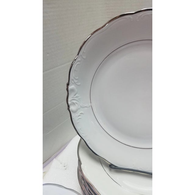 Set of 66 pieces of Walbrzych China from the Walbrzych Porcelain Factory in Poland. White porcelain with silver leaf...