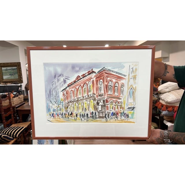 A lively, expressive watercolor and ink architectural sketch capturing the historic Academy of Music building in...