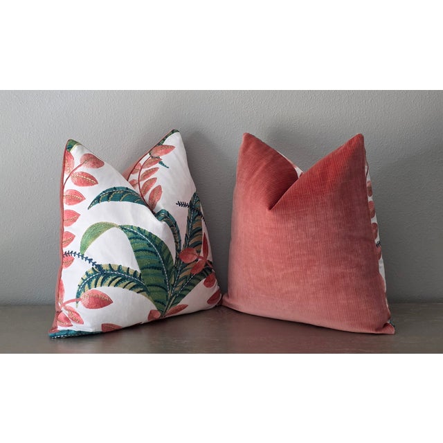 Botanical turquoise embroidered pillows infuse a space with an organic, artisanal elegance that balances vibrant color...