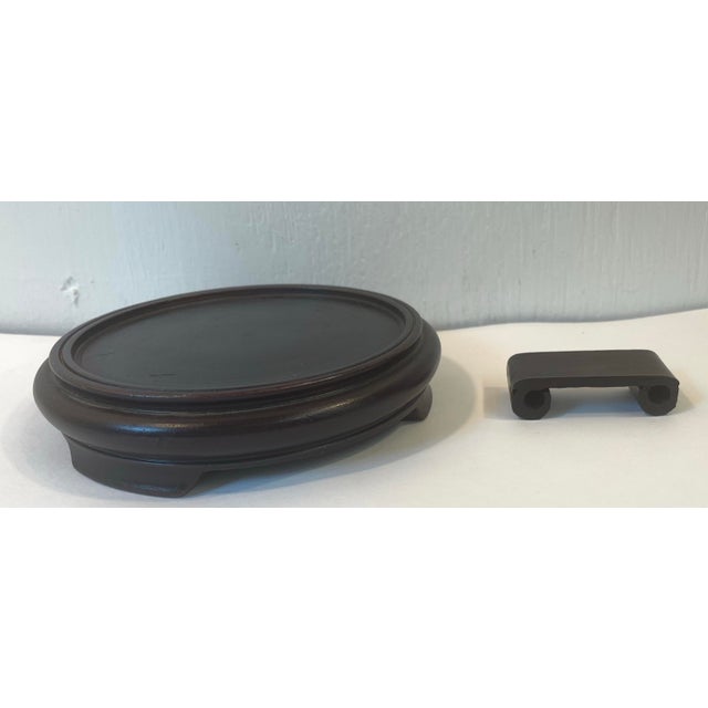 Two vintage Asian display stands, maybe rosewood? Dimensions are of the largest round one.