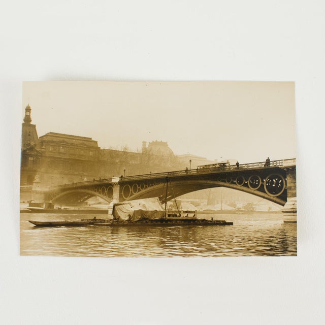 A unique, original silver gelatin black and white photograph by Press Agency Trampus. In Paris, the Carrousel Bridge,...
