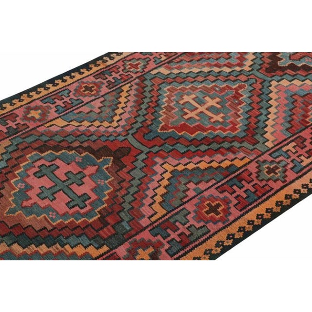 This vintage 5x11 Persian Kilim is an outstanding new addition of Bidjar provenance in Rug & Kilim's rare tribal...