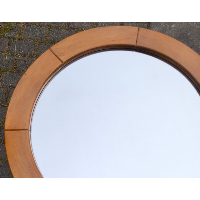 This round mirror is a classic example of Scandinavian mid-century modern design. Its characteristic feature is the wide...