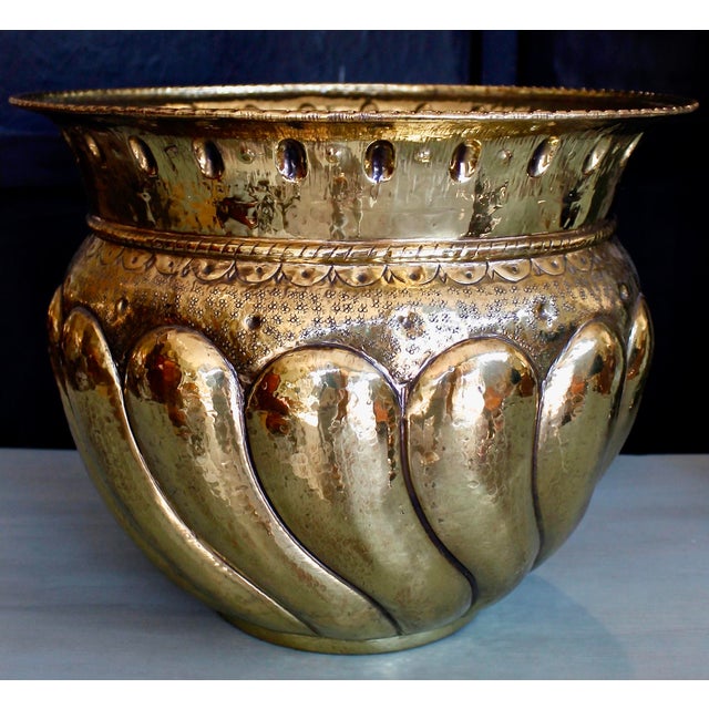 A decorative Italian cachepot of Baroque form, with swirled gadrooning and a variety of punch work patterns, the nicely...