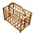 This beautifully restored Mid-century rattan magazine rack featuring a carrying handle featuring an geometric open-grid...