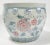 Oversized vintage planter in pastel tones of pink, blue and soft green with detailed floral motif. No chips or cracks. Age...
