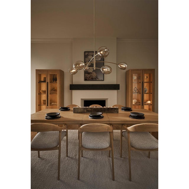 Artemis blends sleek design with the allure of artisan-crafted glass. Its open-ended Champagne glass globes add moody...
