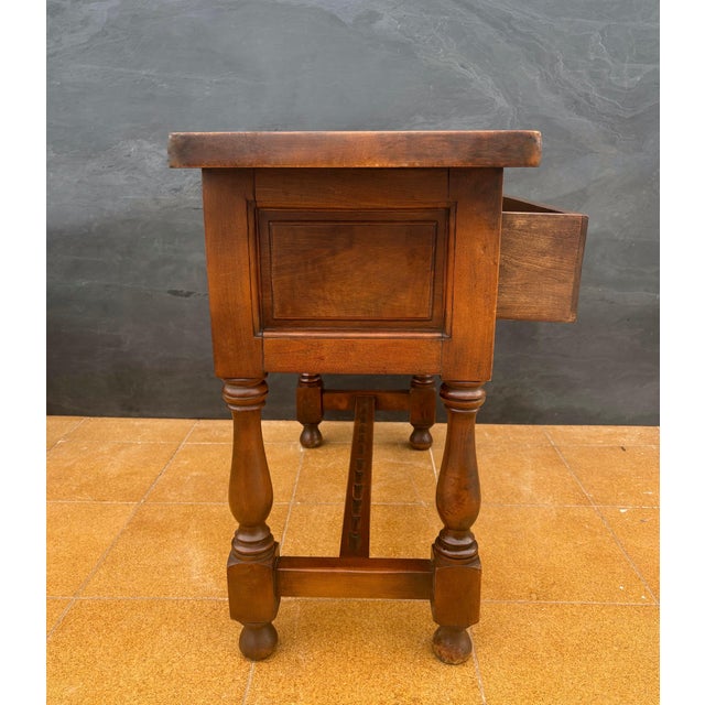 Striking Spanish low console table in the Renaissance Revival style, dating from the 20th century. The piece features a...