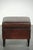 This sheepskin ottoman features a beautiful dark color scheme and is finished with black piping. A footstool, also known...