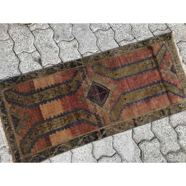 This is a vintage Turkish Oushak rug from the 1960s. The piece was hand-knotted.