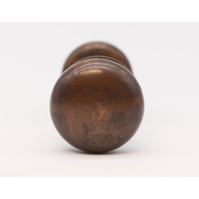 Plain round bronze door knob set with a dark antique patina. The manufacturer is unknown. Priced as two door knobs, two...