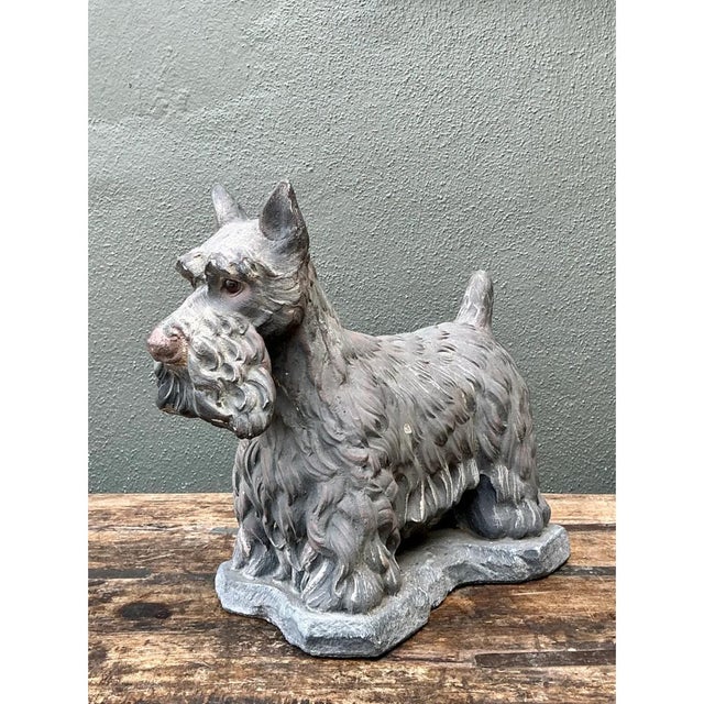 This vintage cast cement Scottish Terrier captures the breed's characteristic alert, sturdy stance, standing with all four...