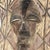 The wooden shield featuring a Kifwebe mask at its center was prevalent in the Songye region during colonial and pre-...