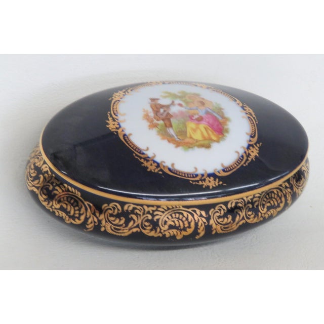 This lovely Lidded Trinket Box is made of Porcelain. This beautiful piece is stamped on the bottom as being made in France...