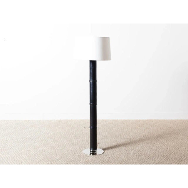 Tall ebonized oak floor lamp. Linen shade. Shade Details: 18.75" X 21" X 12.25". Base: 12" Round. Dimmer switch, 150W...