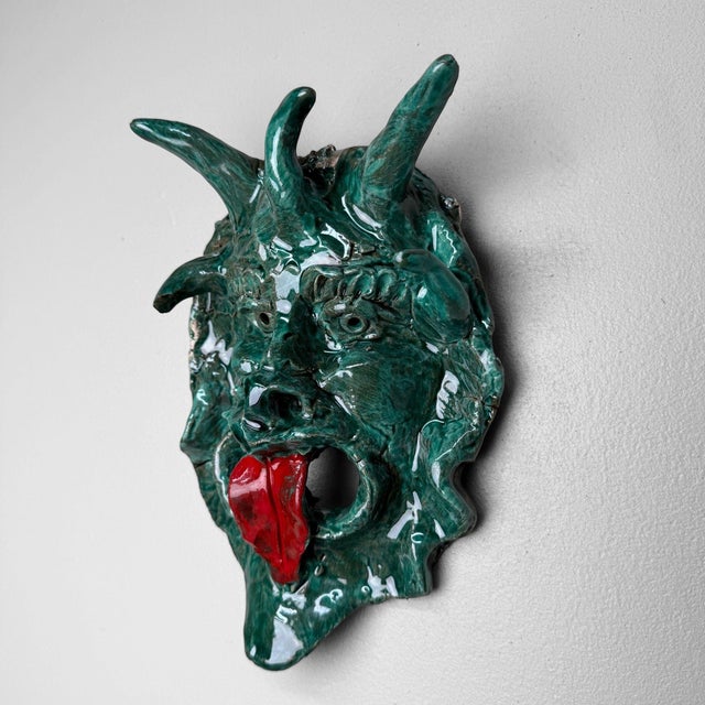 An expressive ceramic wall mask from Seminara, the renowned pottery village in Calabria, made by Gennaro Condurso, a...