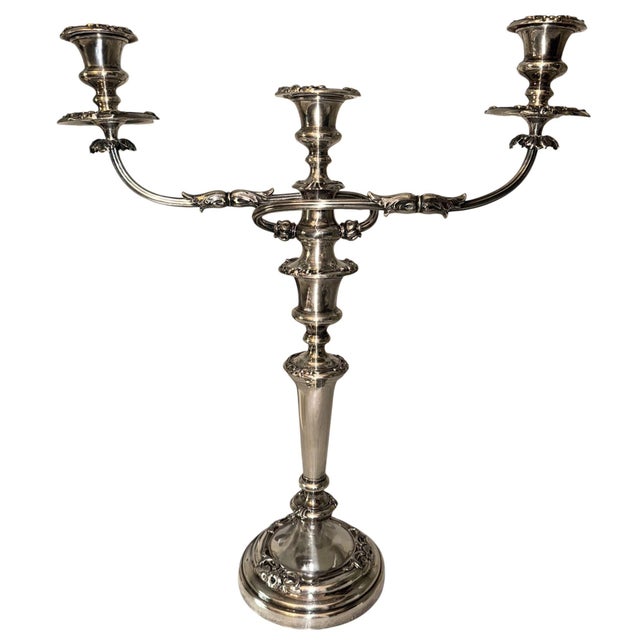 An elegant pair of French mid-20th century silver candelabras, finely executed in the Neoclassical tradition with graceful...