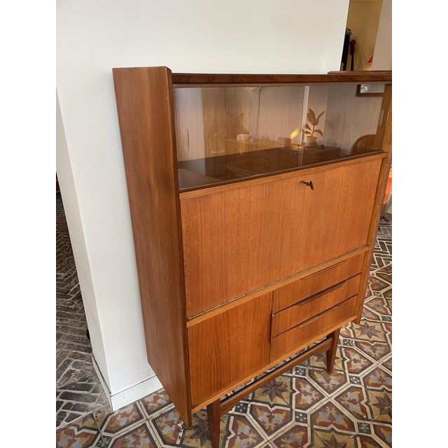 This beautiful danish design secretary desk in teak has a lot to offer: a display cabinet section at the top, the middle...