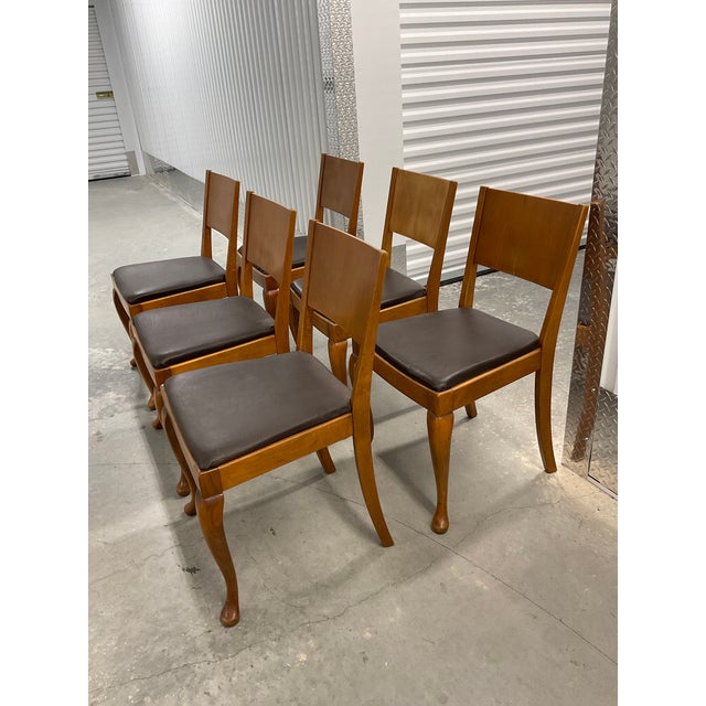 An exceptional and rare set of eight (6) mid-century dining chairs, expertly crafted in Denmark circa 1960. These chairs...