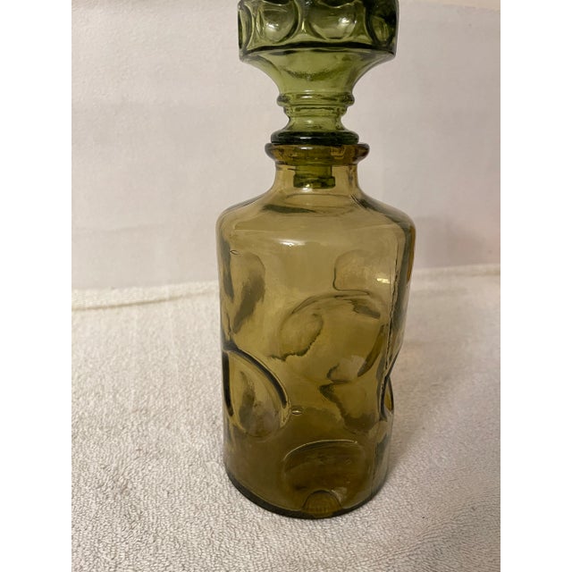 Vintage Art Glass Italian 1960's Decanter with stopper in olive green color. Bottle has concave circles, typical of the...