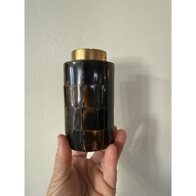 This vintage table lighter is by Sarome of Japan, known for producing sleek, well-made lighters and smoking accessories...
