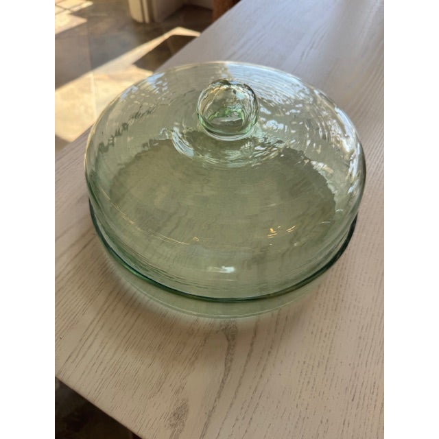 Lovely and durable recycled glass cake plate with lid. clear enough to see thru but still a bit camouflaged by the texture...